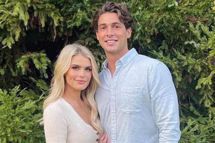Madison LeCroy and Brett Randle are on their wedding dress posing for the photograph.