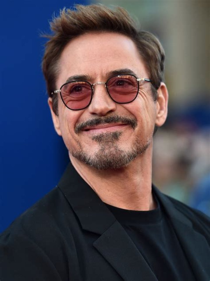 US actor Robert Downey Jr. poses in the press room with the award for Best Performance by a Male Actor in a Supporting Role in any Motion Picture f...